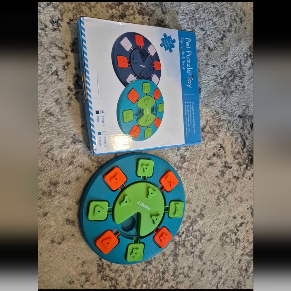 Dog puzzle interactive toy treat dispenser. Used once with box